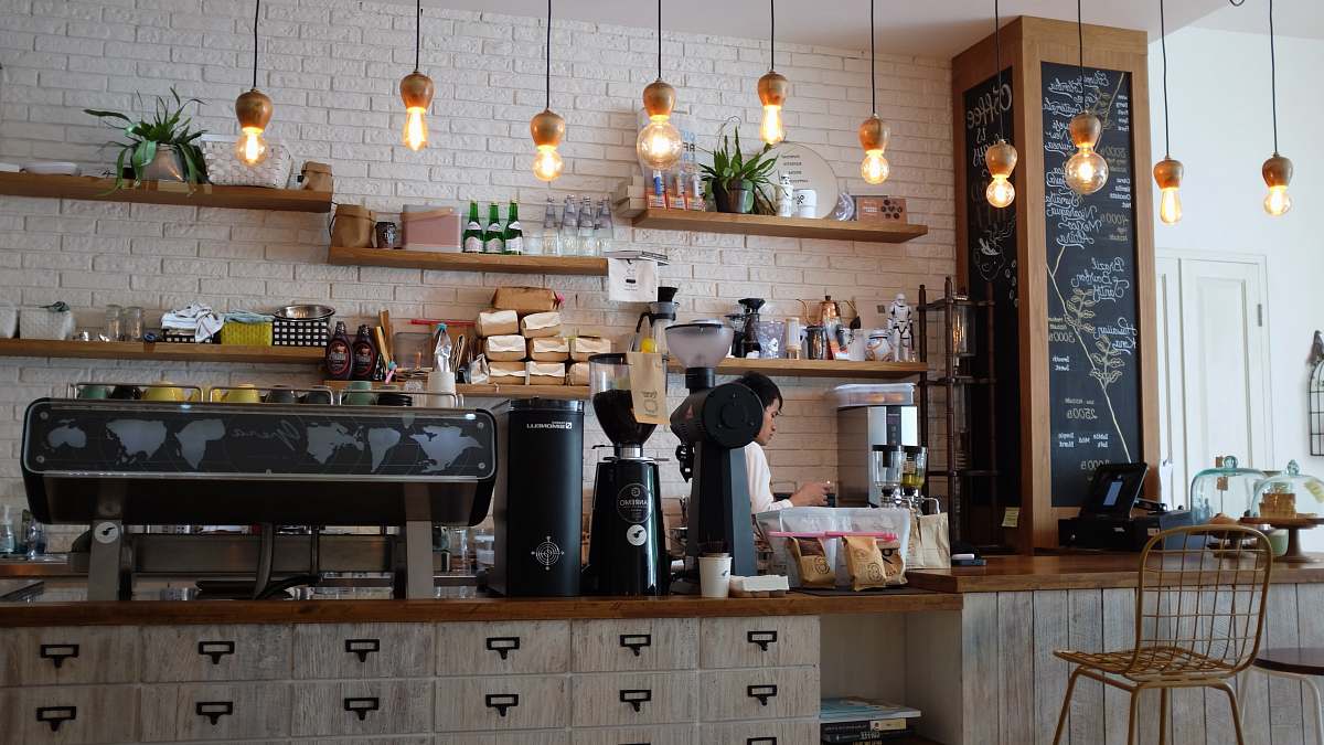 coffee shop black kitchen appliance on kitchen island with pendant lights cafe